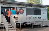 Left to right – Steam Packet Company Sales Development Manager Brian Convery, Island of Culture Director Michael Lees, Oliver Mason and Wilf Petherbridge from the MusicLab, and Steam Packet Company Marketing and Online Manager Renee Caley, pictured with the MusicLab outside St John’s School