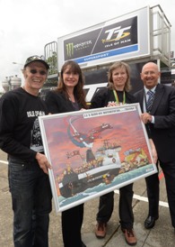 A picture of Ben-my-Chree is presented to representatives of the Isle of Man Steam Packet Company by Ride-on MotorTours. Pictured from left are Rob de Jong, of Ride-on MotorTours, Steam Packet Company Marketing and Online Manager Renee Caley, Dafne de Jong of Ride-on MotorTours and Brian Convery, Steam Packet Company Sales Development Manager