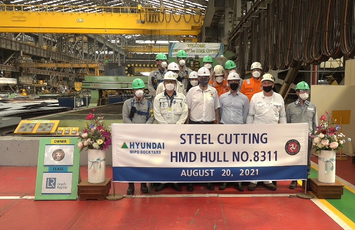 Group of workers posing for photo at the Manxman Vessel Steel Cutting Ceremony