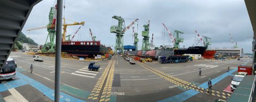 Ferry in shipyard being built with cranes around it