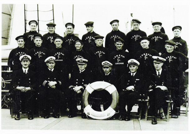 Black and white photo of Steam Packet Company crew on Mona’s Queen posing on board the vessel