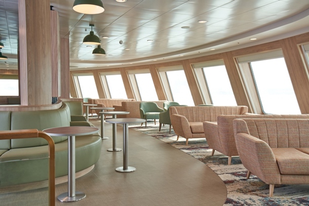 View of the cafe on ferry with seats looking out to large windows