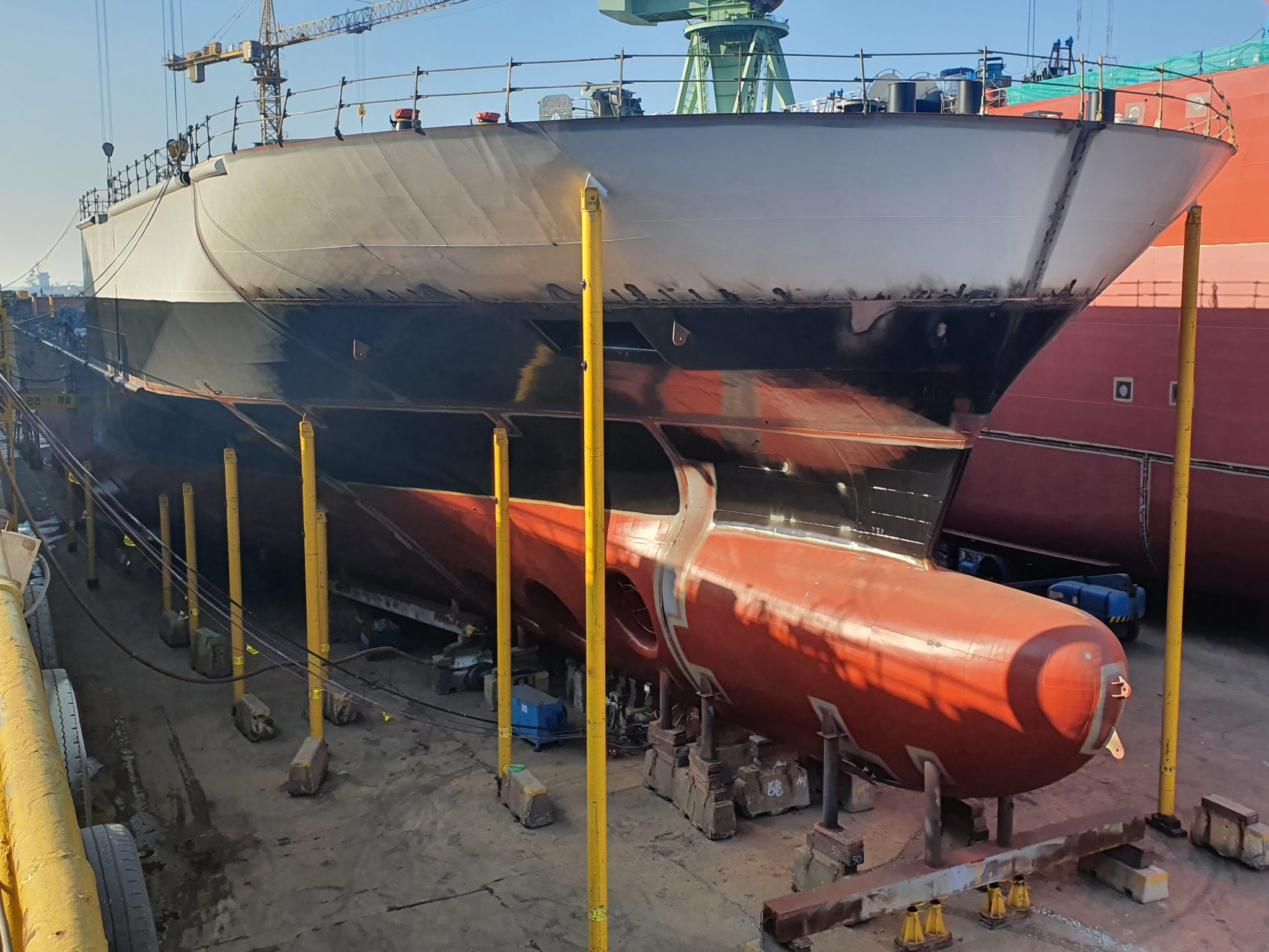 Ferry in shipyard with supports to hold it up